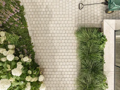 paving from a bird’s-eye view with adjacent flower bed