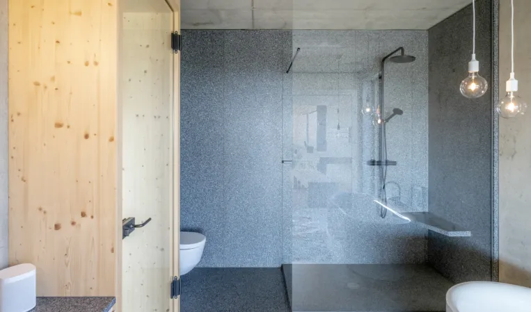 granite shower with glass partition