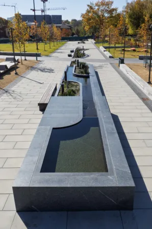 very long runnel made out of dark granite