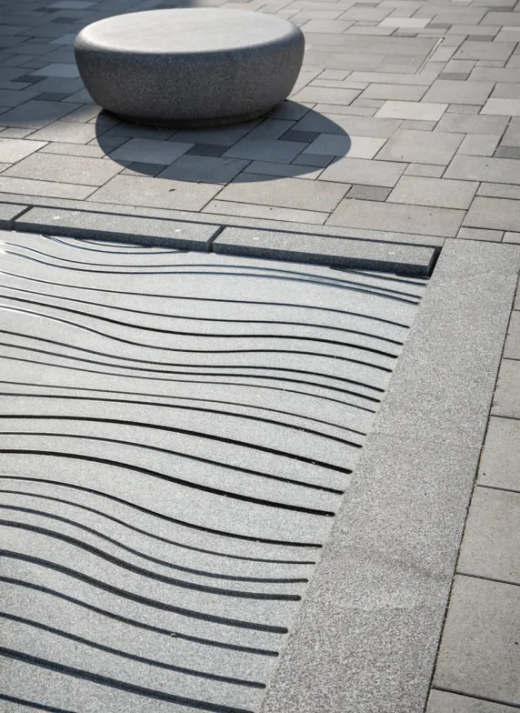 Fountainfield with grooves and a seating made of solid granite