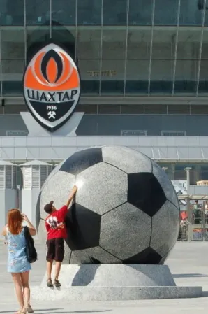 Floating Sphere with a soccer ball design and a kid playing