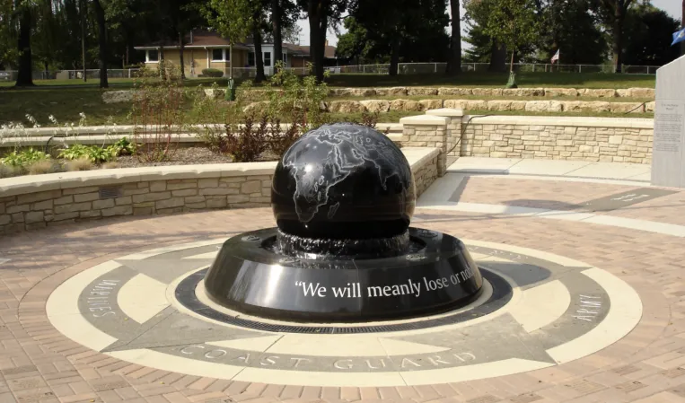 Black granite sphere with engraved world map