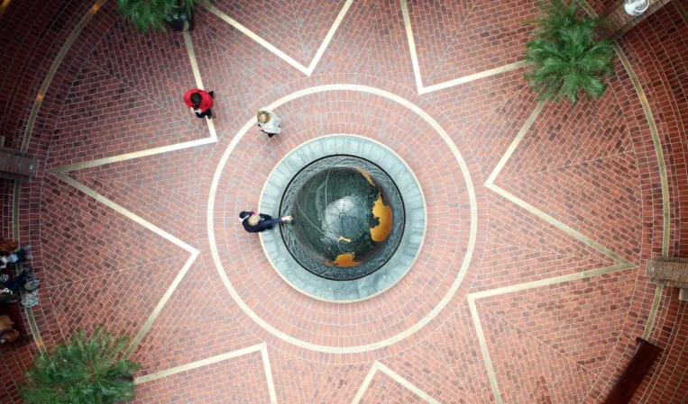 Rotating granite sphere in a fountain installation viewed from above