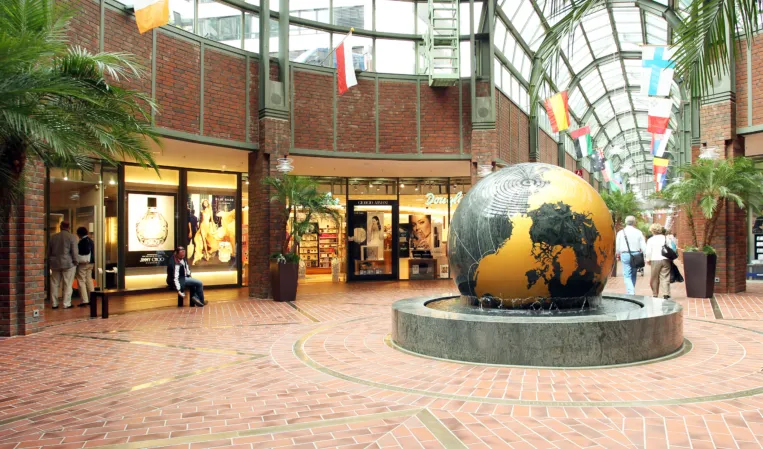 Rotating granite sphere with golden world map