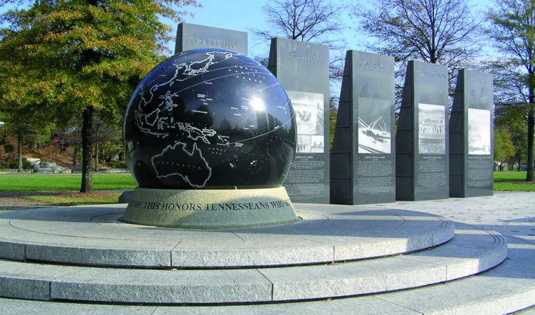 Granite sphere with engraved world map in a memorial