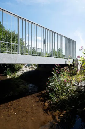 Post-tensioned granite bridge over a river