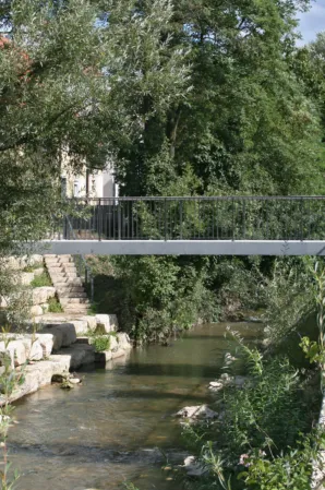 Post-tensioned granite bridge