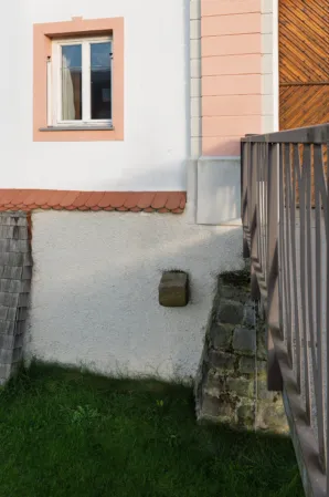 Natural stone bridge pillar integrated into a castle