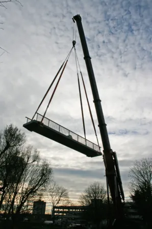 Crane installation of a granite bridge