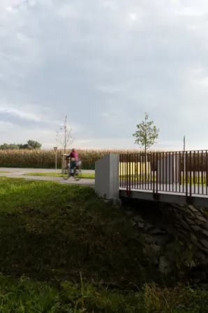 Cyclist riding across the cycle path bridge