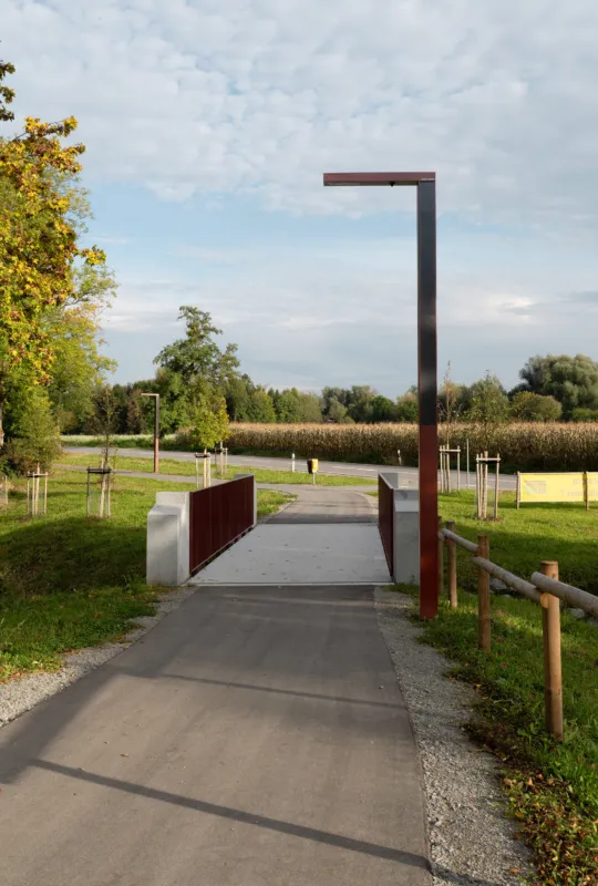 A post-tensioned cycle bridge made out of granite in a country side