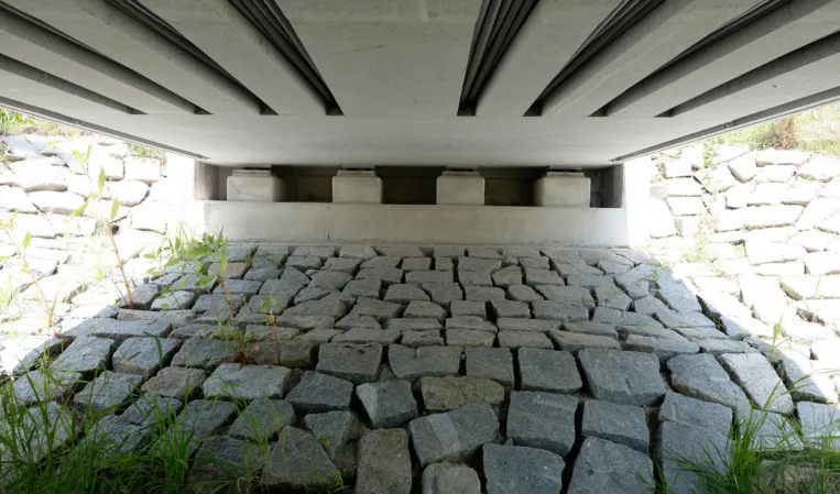 Underside view of a post-tensioned granite bridge construction