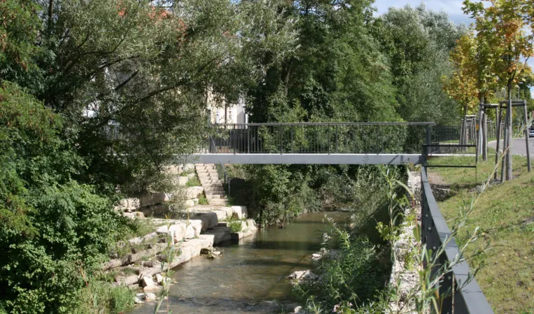 Post-tensioned granite bridge