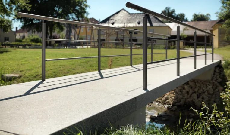 Granite bridge leading to a courtyard