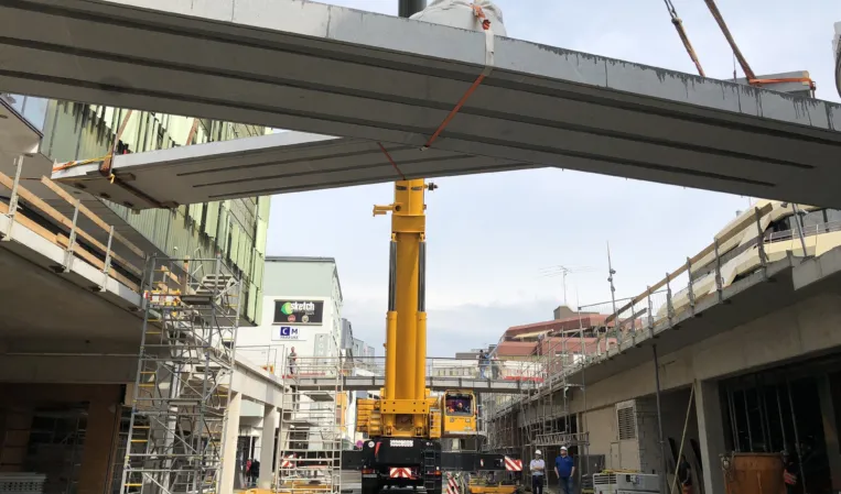 Crane installation of two granite bridges
