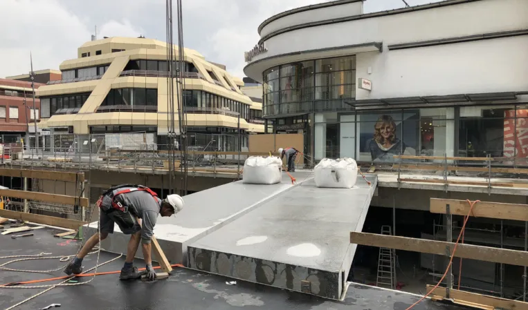 Installation of a granite bridge between two buildings