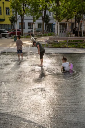 Children playing in a water jet field