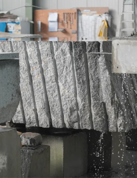 Solid raw block being cut with a horizontal wire saw