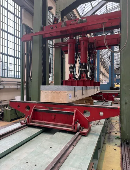 large-scale measurement test of a post-tensioned granite bridge