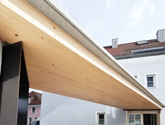 a wood granite bridge between two houses