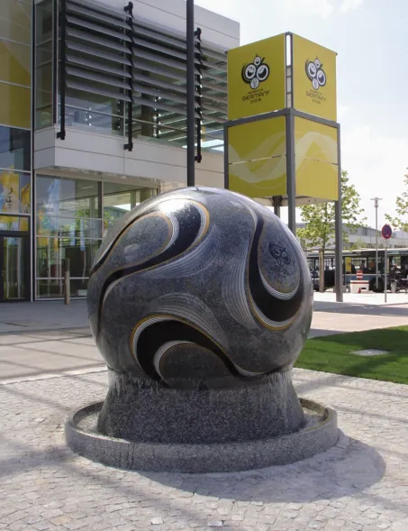 floating granite sphere resembling a football