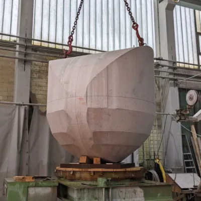 quarry block being milled into a sphere step by step