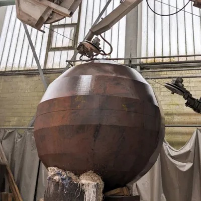 granite sphere receiving its final shape