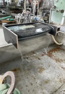 A piece of a fountain in a factory to test the water flow of a fountain
