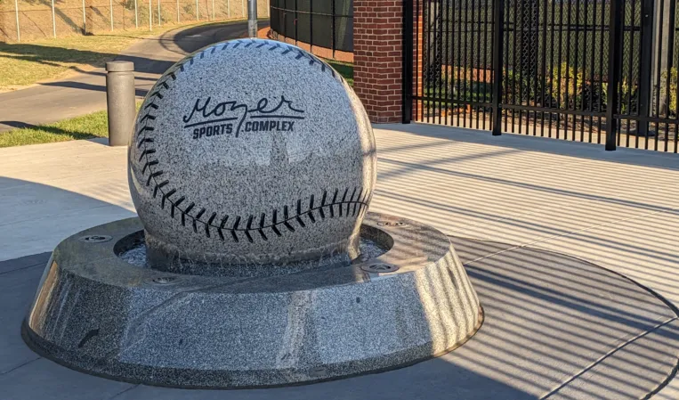 Granite sphere fountain shaped like a baseball at the Moore Sports Complex