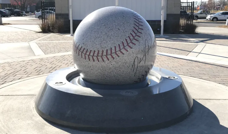 Floating granite sphere with engraved baseball design