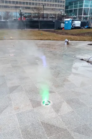 Close-up of illuminated fog jets embedded in the pavement at the Theodore Roosevelt Memorial