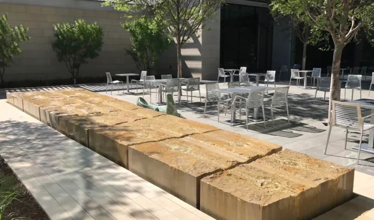 Monolithic limestone water table fountain with a crocodile bronze sculpture next to it