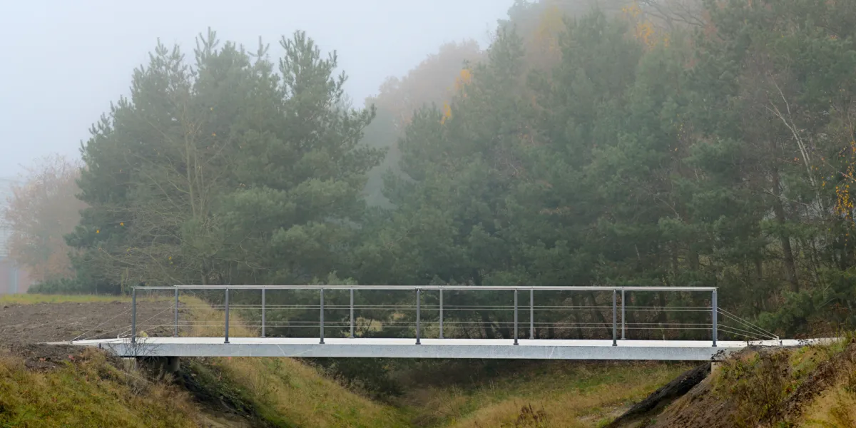 a post-tensioned granite bridge in the midst of nature