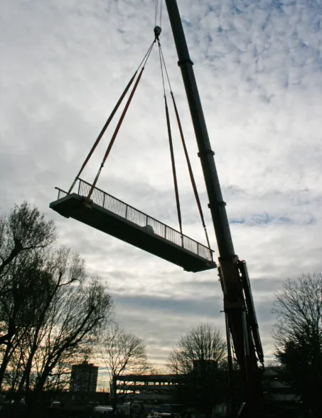 a cran installation of a post-tensioned granite bridge